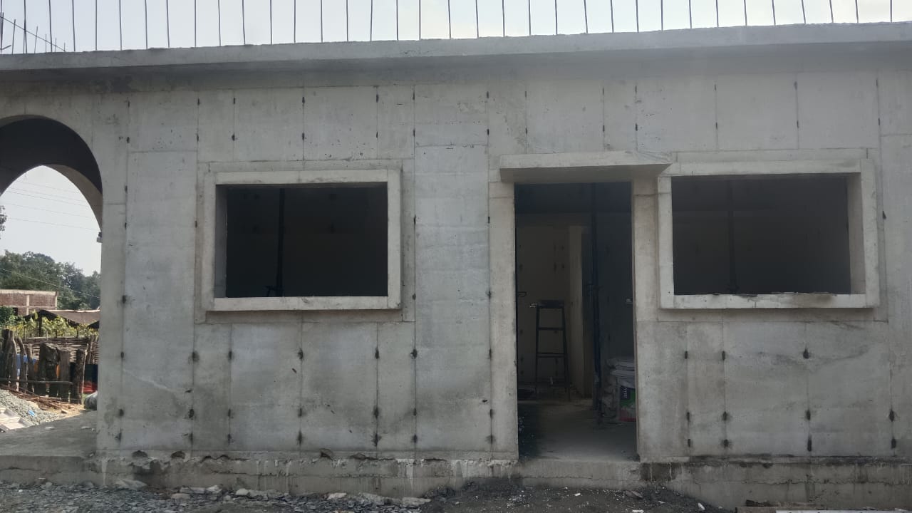 Completed concrete wall with arch opening